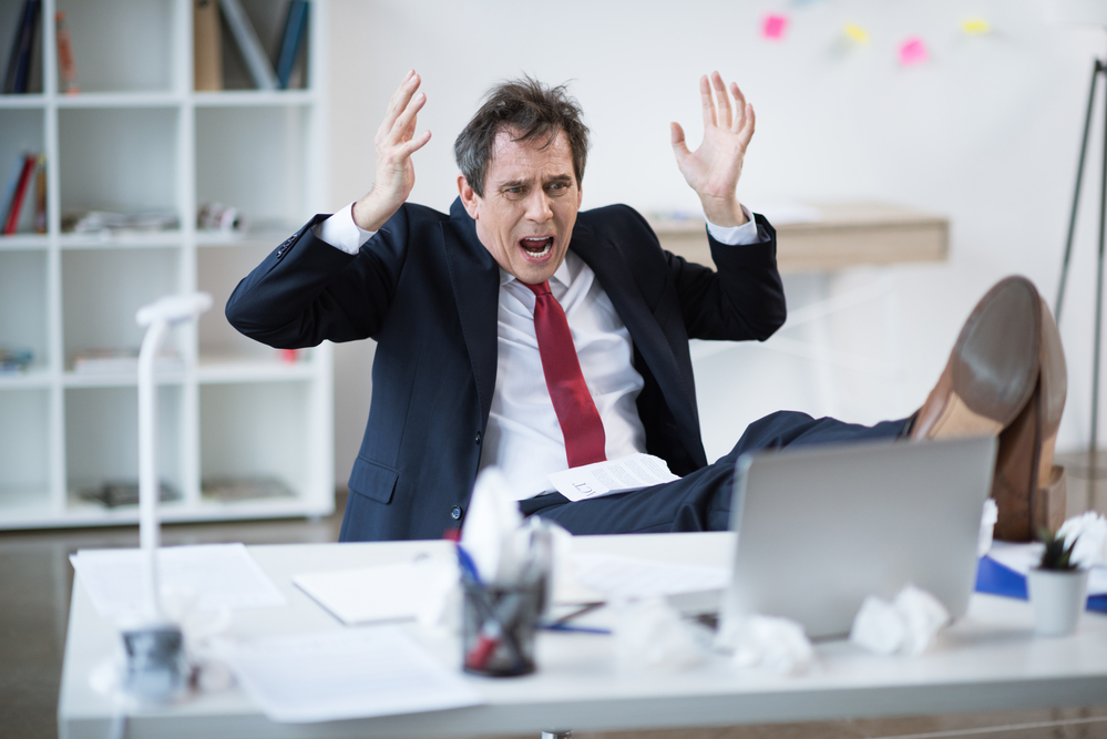 Delegating Panicked Businessman Panicked Businessman at Desk