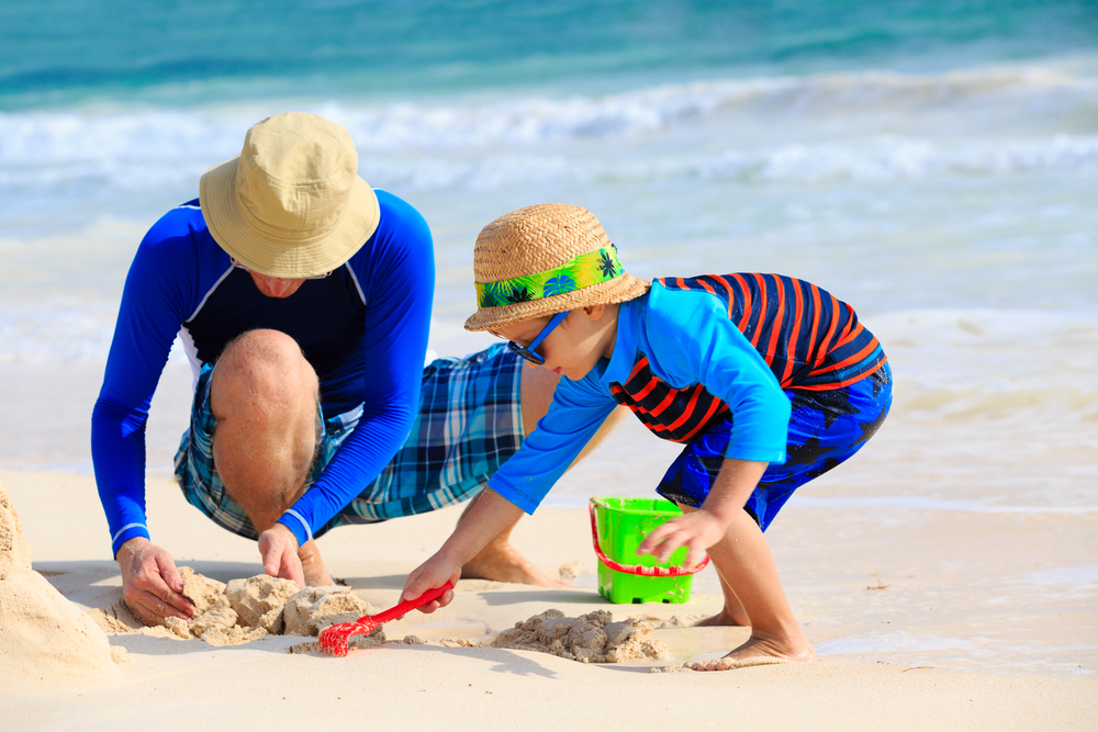 Building Sandcastles on the Beach Father and Son Building Sandcastles on the Beach