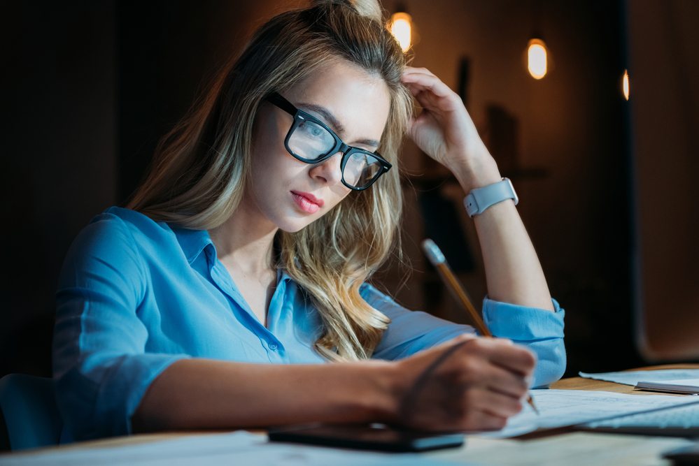 Femaie College student studying at night