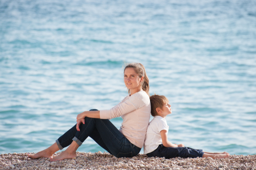Mom Leaning Against Child Relaxing