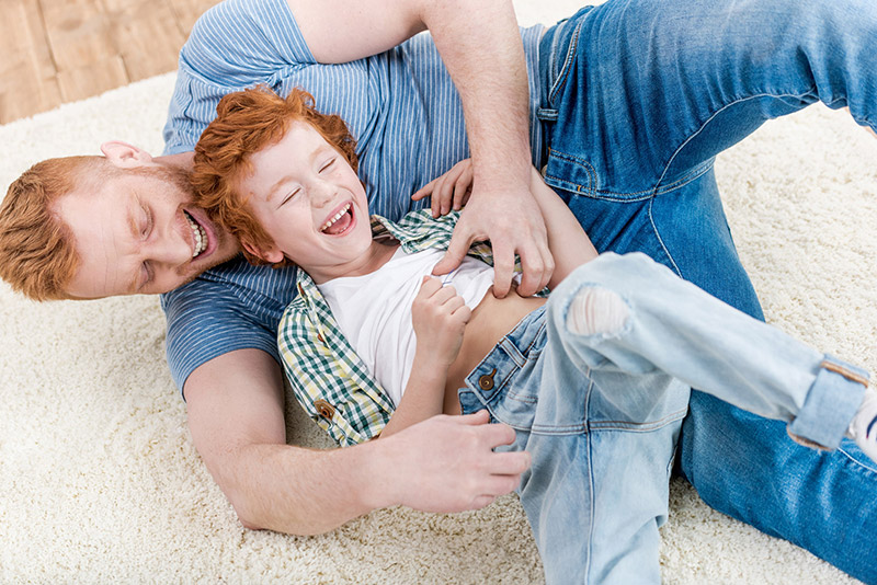 Father and Son Playing on the Floor