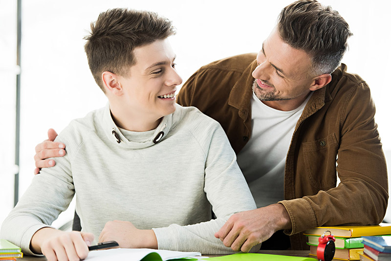 Homework and ADHD - Father with Older Son Father with Older Son doing Homework