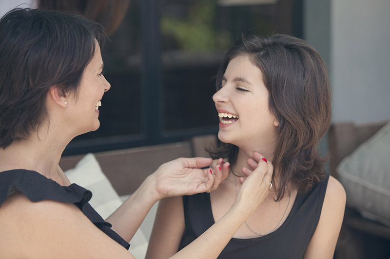 mother and daughter laughing